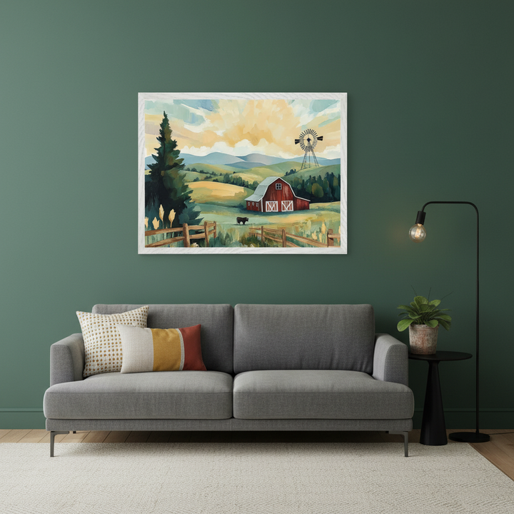 Modern living room with a gray sofa. A large framed painting of a farm scene with a red barn, windmill, and cow under a yellow sky hangs centered above the sofa. A black side table and floor lamp are on the right.