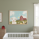 Modern nursery with a white crib in the foreground. A large framed painting of a whimsical white lamb in a field with yellow flowers, a red barn, and a sunny blue sky hangs centrally on the green wall above a wood dresser. A cream armchair with a sheep plush is on the right.