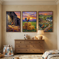 Three framed vertical farm-themed illustrations hang side-by-side on a cream wall above a wooden six-drawer dresser. The left piece shows a rooster in the doorway of a sunlit barn. The center piece features a rooster perched on hay bales in a field at sunset. The right piece portrays a rooster in a farm scene with a cottage and rolling hills. On the dresser are a plush cow, a small wooden animal toy, and a warm lamp. A basket with a patchwork blanket sits on the patterned rug below.