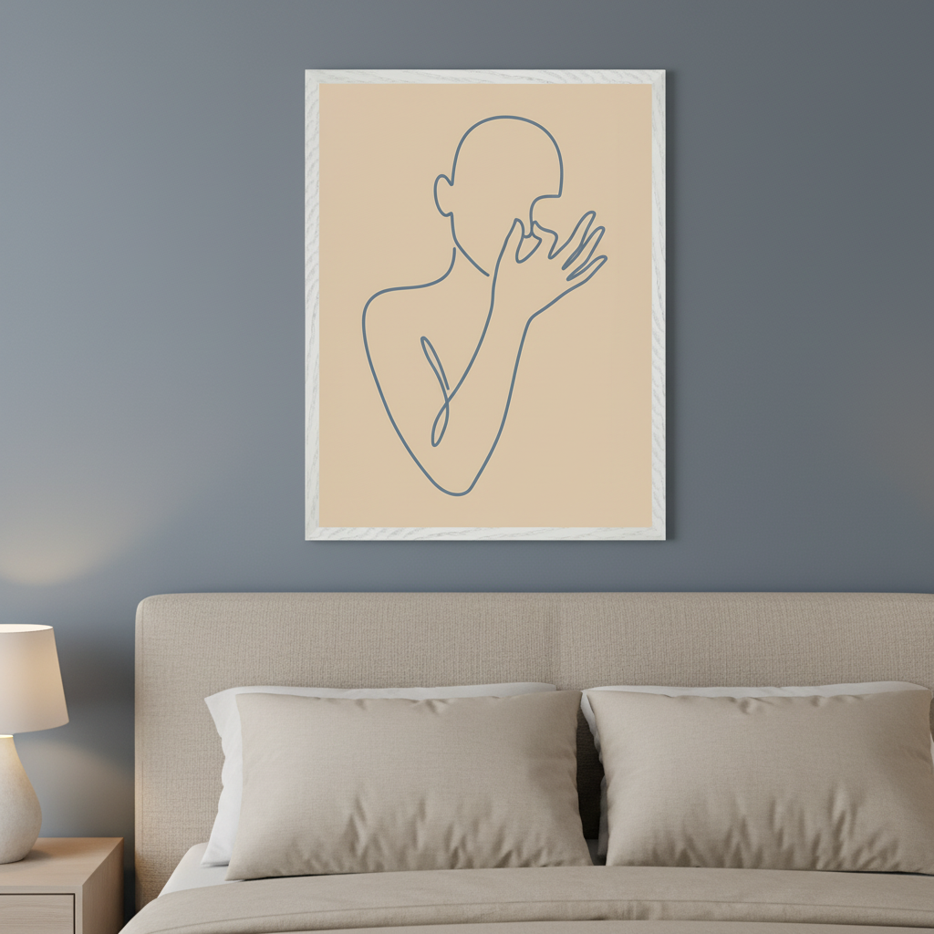Modern bedroom with a beige upholstered bed and a nightstand. A framed blue line art drawing of a person with hands covering their face, on a beige background, hangs above the bed.