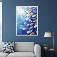 Modern living room with a light gray sofa and a small side table. A large framed impasto painting of colorful fish swimming in blue water with light from above hangs on the blue wall, above the sofa.