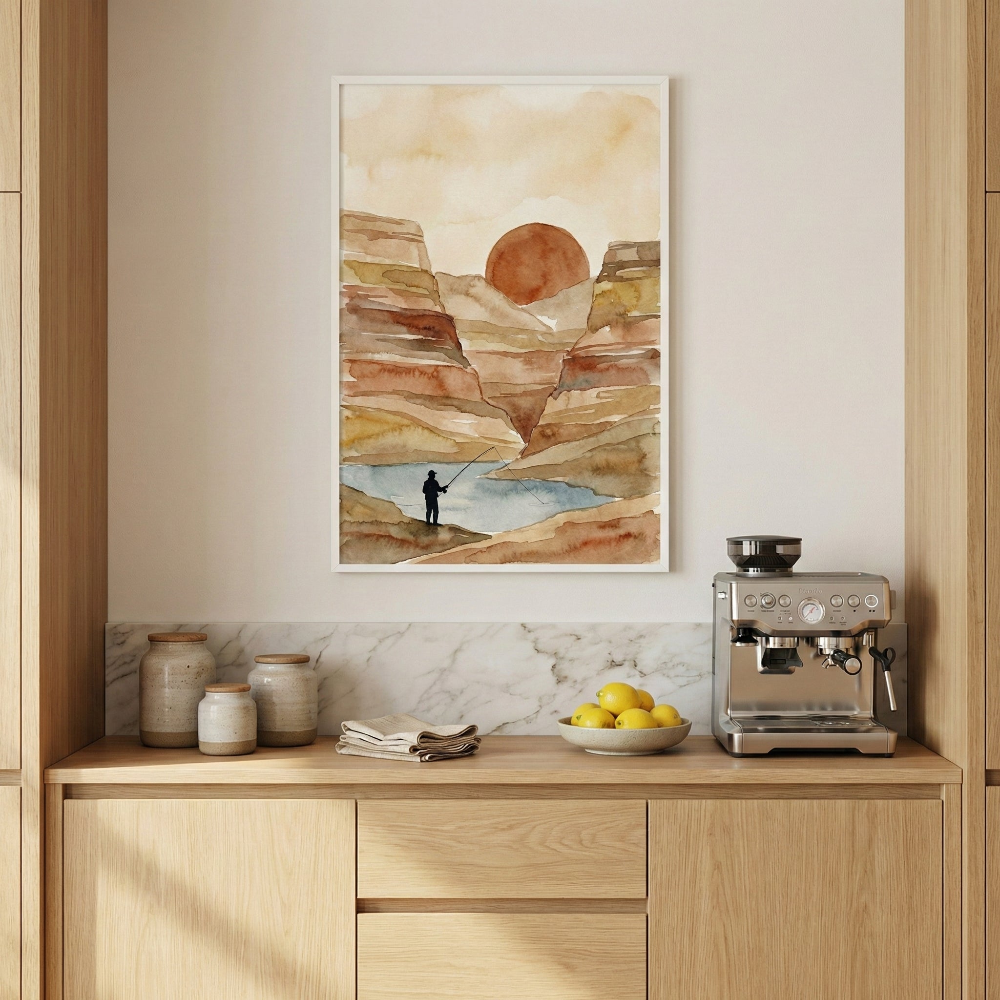 Framed artwork of a fisherman fishing in a small river winding through sunlit desert canyons, displayed in a cozy kitchen. The scene blends natural textures with a peaceful desert backdrop.