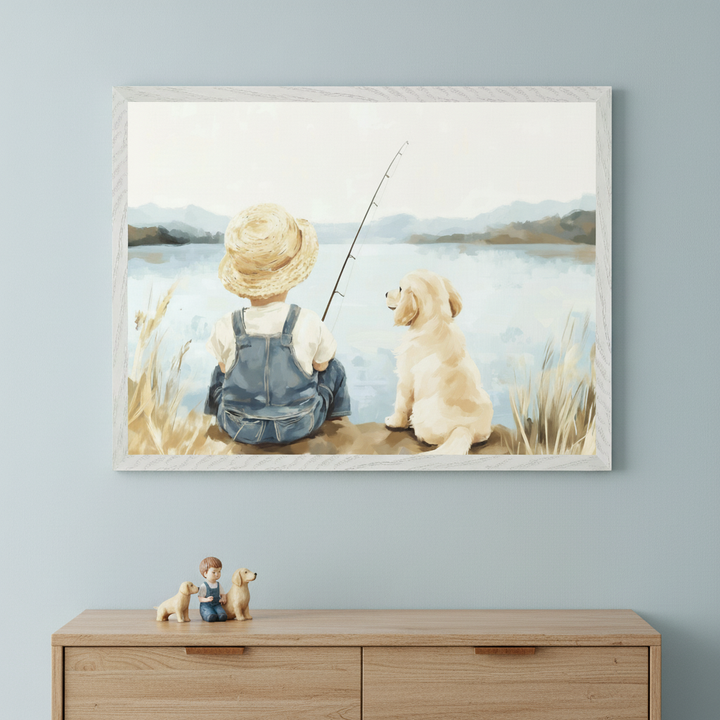 Kid's room with a light blue wall and a wooden dresser. A framed watercolor painting of a boy in a straw hat and overalls fishing with a golden retriever by a lake hangs centered above the dresser. Figurines of a boy and two puppies sit on the dresser.