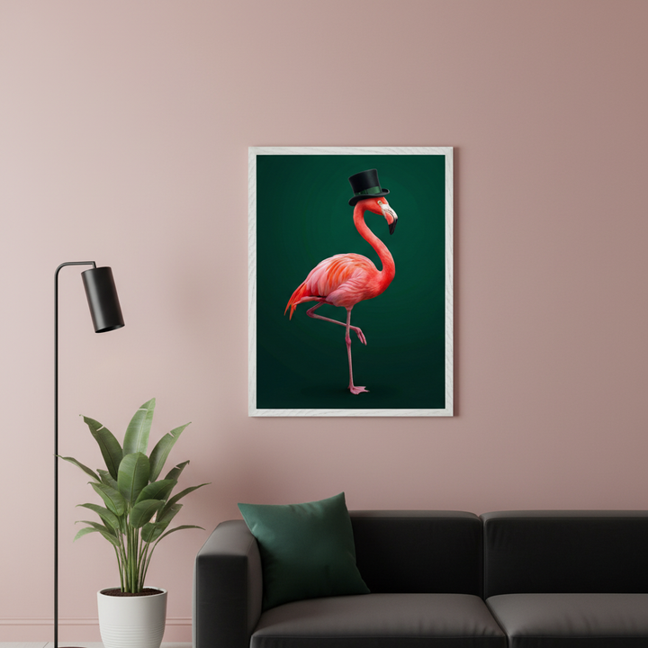 Modern living room with a black leather sofa. A large framed print of a pink flamingo wearing a black top hat on a dark green background hangs above the sofa. A floor lamp and a potted plant are on the left.