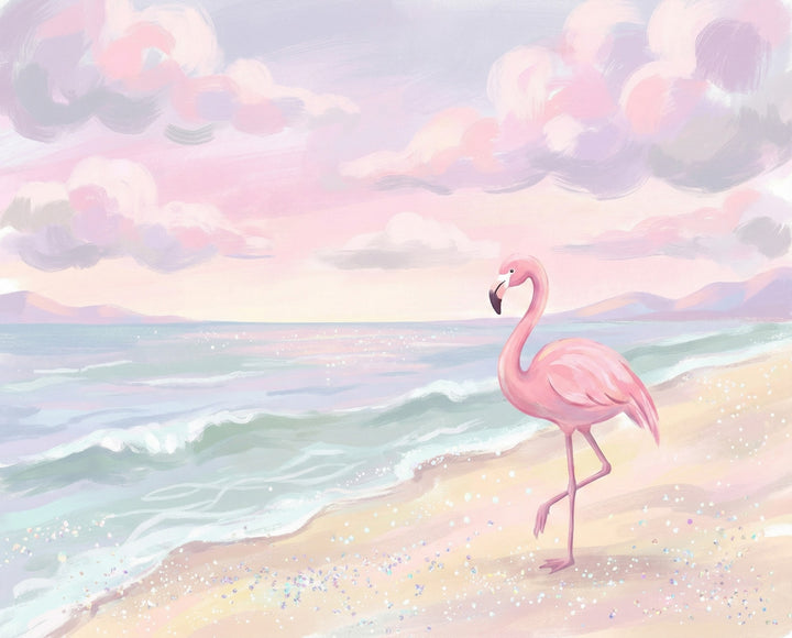 A soft pink flamingo stands at the edge of a sparkling pastel-colored beach with calm waves and dreamy clouds in a serene sunset sky.
