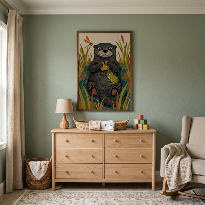 Sage green nursery with a light wood dresser and floating frog friend otter animals wall art.