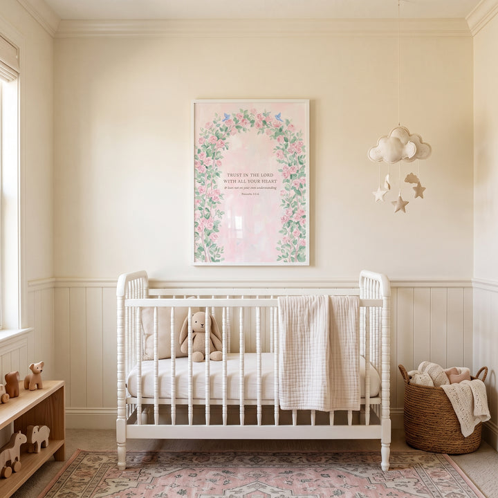 Neutral nursery with floral arch proverbs verse bible wall art above a white crib, a cloud mobile and patterned rug.