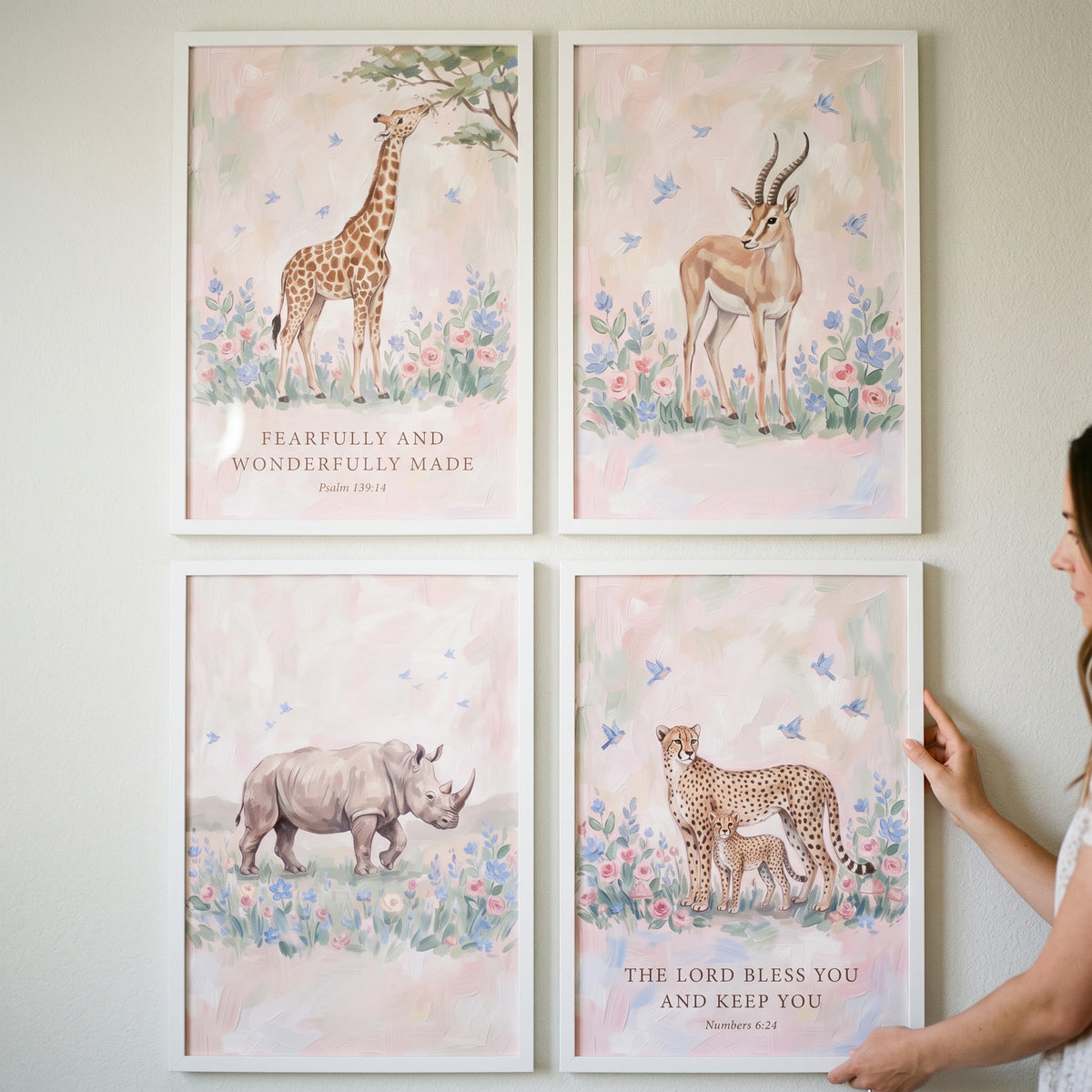 Floral bluebird safari animals wall art set of 4 featuring a giraffe, gazelle, rhino, and cheetah with scripture.