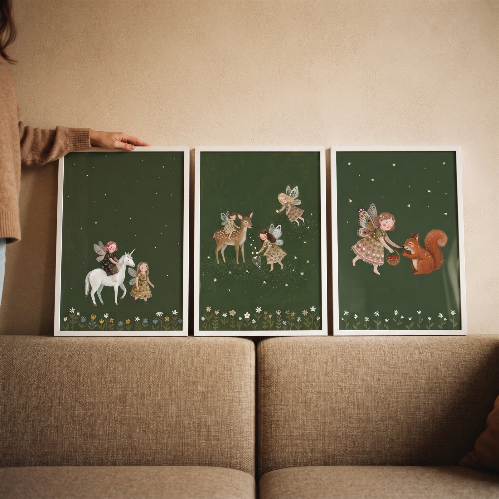 Floral border winged fairies wall art set of 3 featuring a unicorn, deer, and squirrel against dark green backgrounds.
