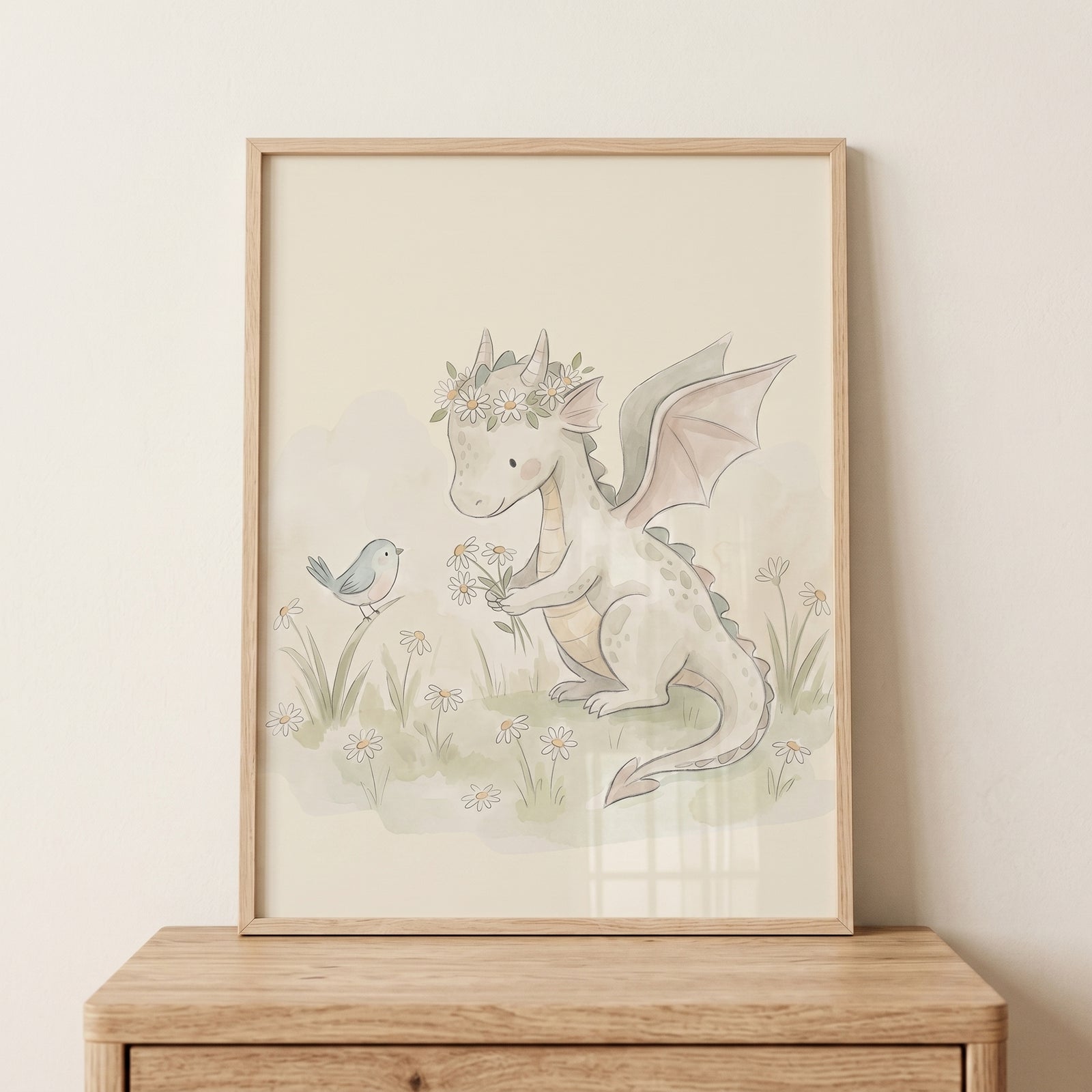 Framed floral crown baby dragon wall art shows a green dragon and blue bird in a watercolor meadow of daisies.