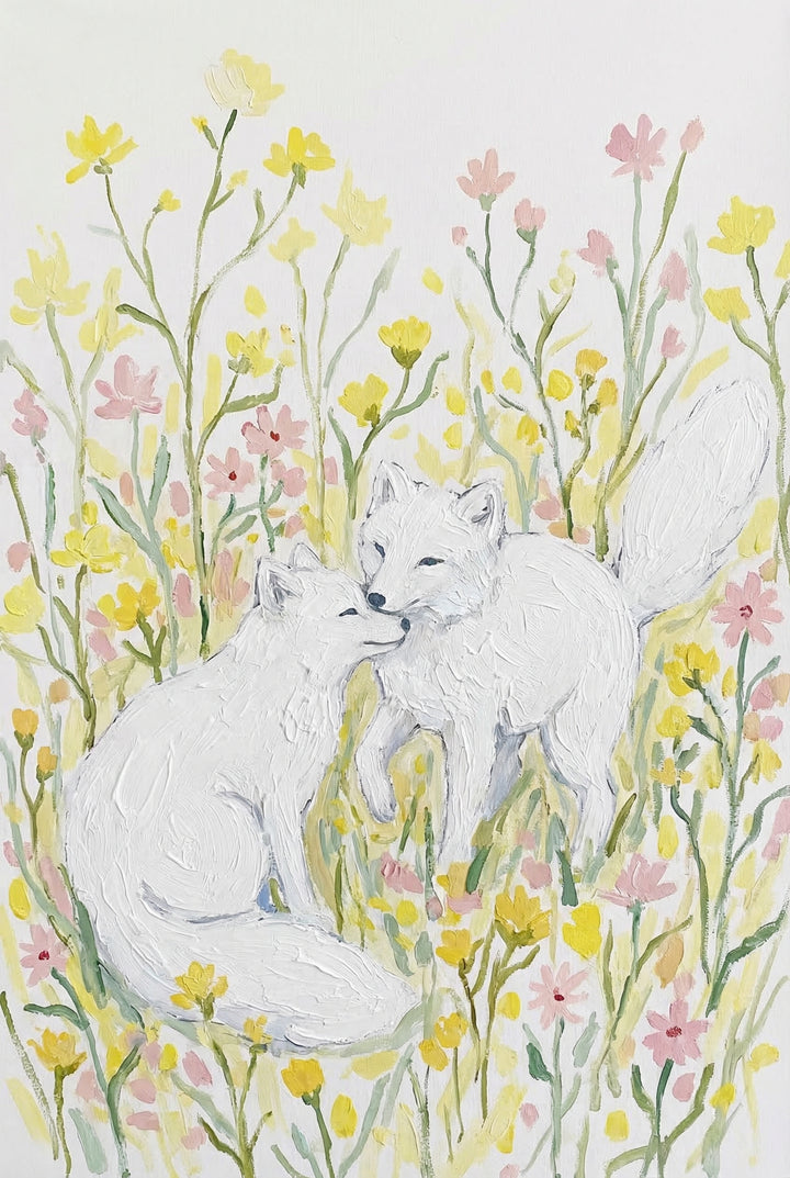An artwork of two white foxes sharing an affectionate moment in a meadow of wildflowers. One fox sits while the other stands, their noses touching in a gentle nuzzle. They are surrounded by a field of small yellow and pink flowers with slender green stems. The piece features thick, visible strokes that create a sense of tactile depth. The overall scene is bright and airy, composed of soft pastel colors against a clean white background.