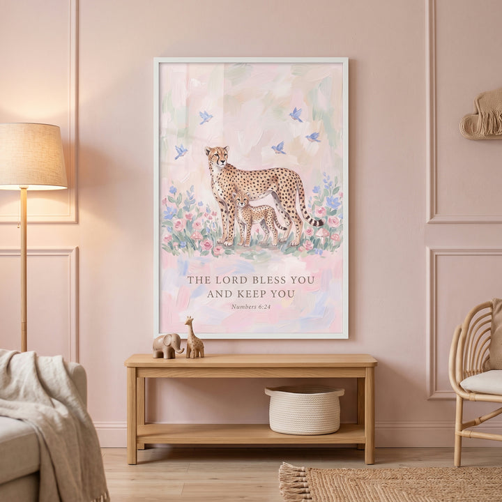 Floral mother baby cheetah bible wall art hangs above a wooden bench in a soft pink nursery with a floor lamp.