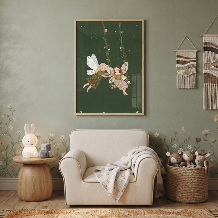 Nursery featuring floral vine swinging fairies wall art, a cream armchair, white rabbit lamp, and a woven basket.