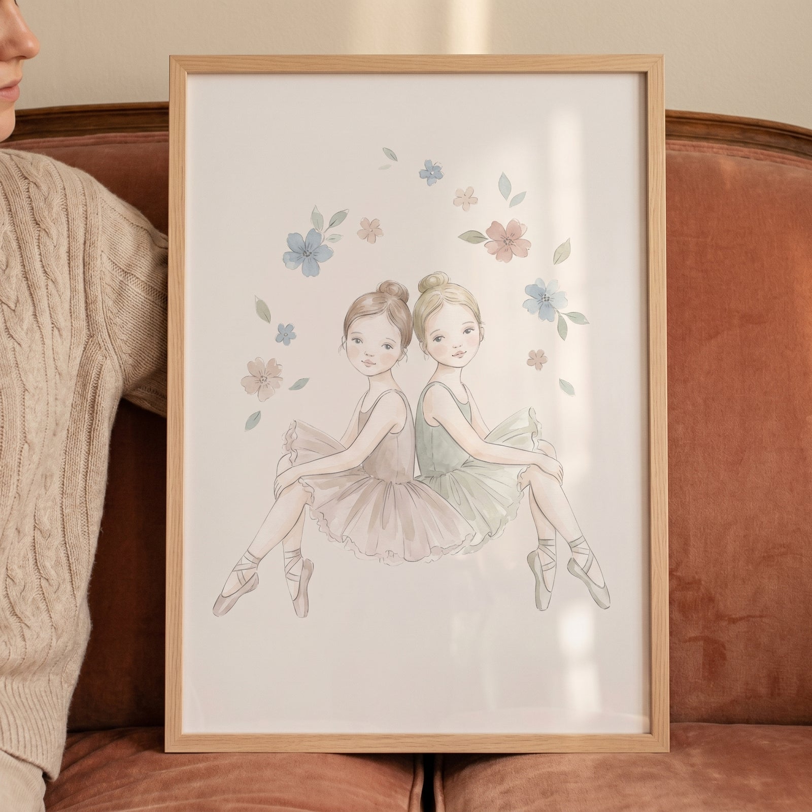 Framed floral wreath watercolor ballerina wall art featuring two girls in tutus sitting back-to-back.