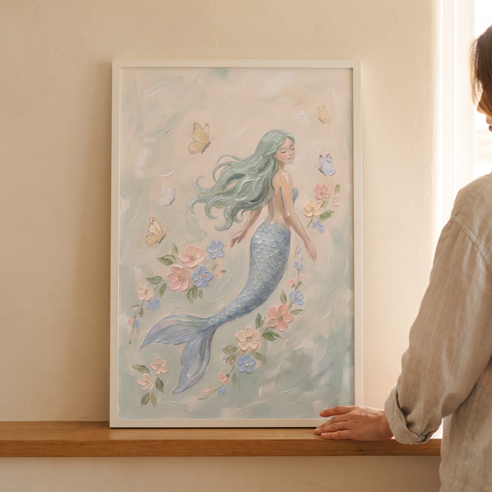 Framed flowing teal hair mermaid wall art featuring a mermaid swimming among delicate flowers and butterflies.