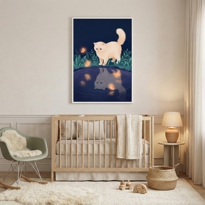 A cozy nursery features a wooden crib with a knitted blanket, a plush rug, and a rocking chair with a fur throw. A soft lamp sits on a side table, and a woven basket is nearby. Above the crib hangs a whimsical illustration of a fluffy white cat by a pond, with its reflection and glowing butterflies in the water.