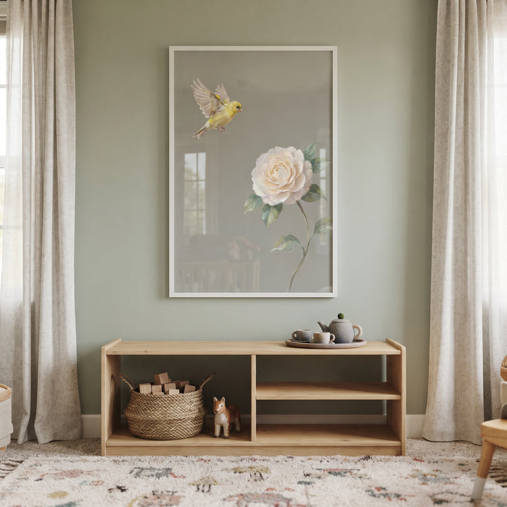 Flying vintage yellow bird floral wall art above a wooden shelf in a room with sage green walls and white curtains.