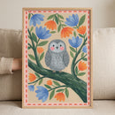 Framed folk floral grey owl wall art features a bird on a branch with blue and orange flowers and a red dashed border.
