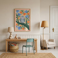 Folk floral grey owl wall art hangs above a desk with a bunny lamp, teal chair, armchair, and floor lamp in a neutral room.