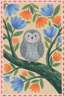 Folk floral grey owl wall art features a grey owl perched on a branch, framed by blue and orange flowers and a pink border.