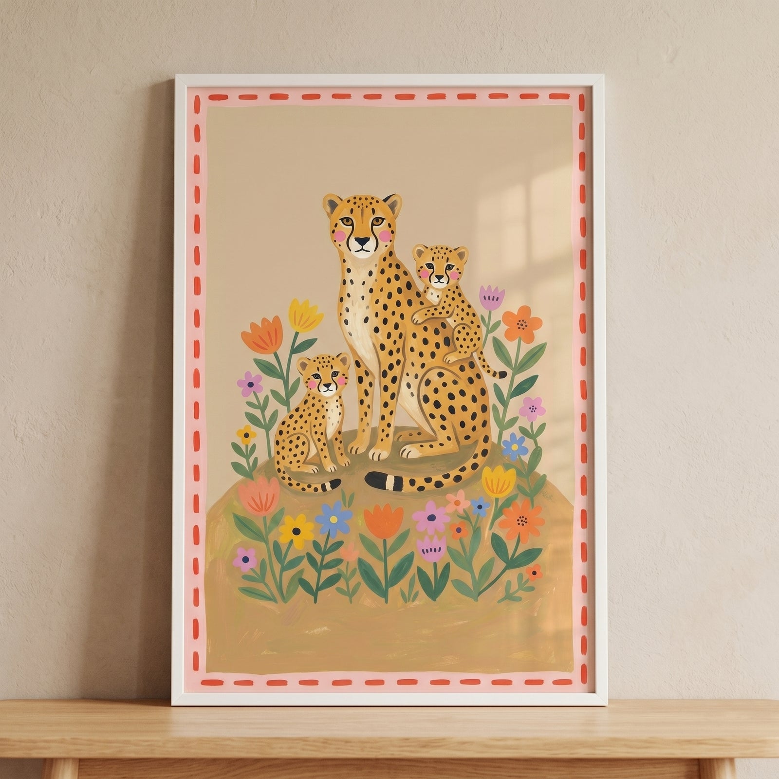 Folk floral mother cheetah wall art shows a mother and two cubs among vibrant blossoms with a pink dashed border.