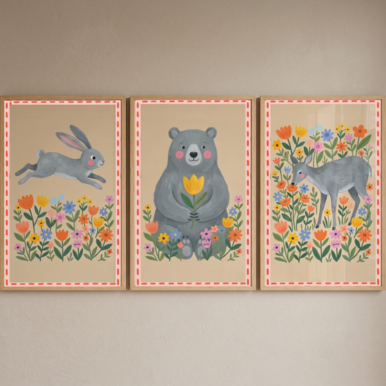 Folk grey forest animal wall art set of 3 featuring a jumping rabbit, a sitting bear, and a standing deer in flowers.
