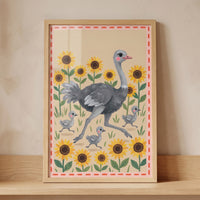 An ostrich and three chicks run through sunflowers in this framed folk sunflower garden ostrich wall art.