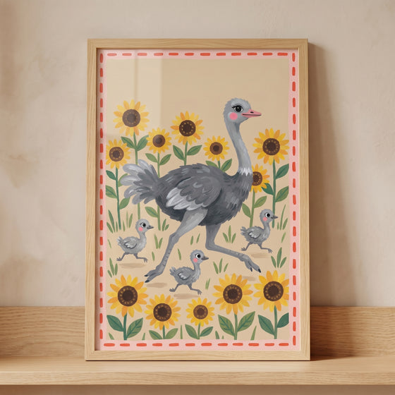An ostrich and three chicks run through sunflowers in this framed folk sunflower garden ostrich wall art.