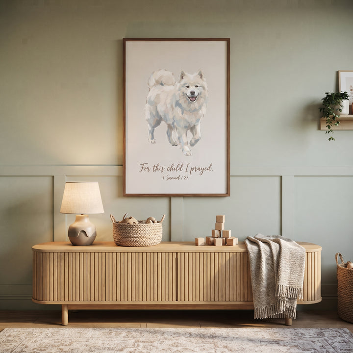 Framed for this child samoyed wall art on a sage wall above a wooden fluted console table with a lamp and blocks.