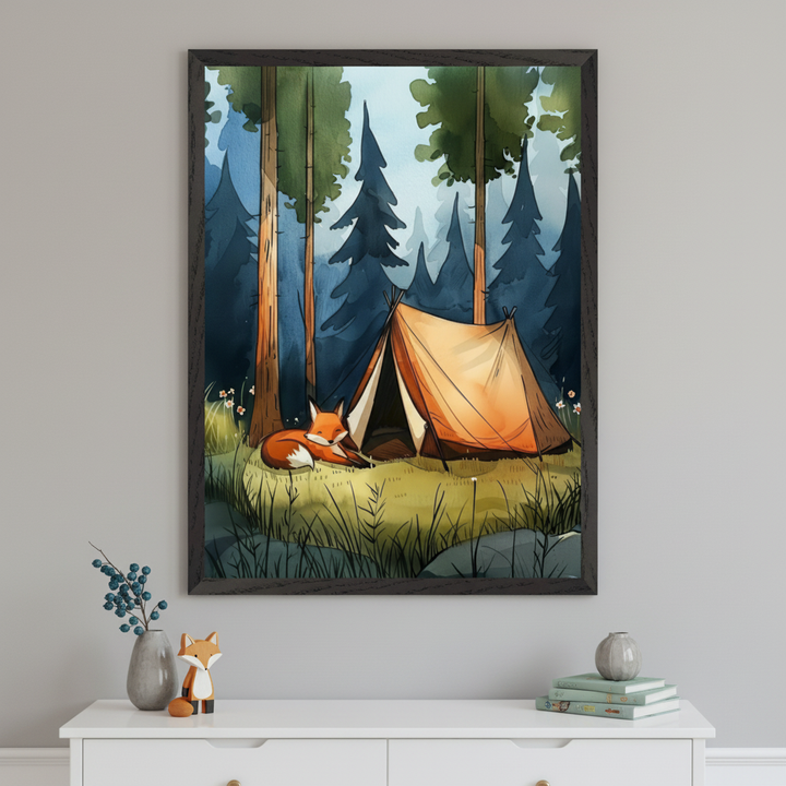 Framed illustration of a cozy forest campsite with a tan canvas tent pitched among tall trees, and a red fox curled up sleeping beside it on a patch of sunlit grass. The artwork hangs above a white dresser decorated with fox-themed and nature-inspired decor, evoking a peaceful woodland vibe.