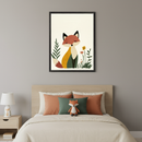 Modern kid's bedroom with a light wood bed and nightstand. A black-framed illustration of a stylized fox in earth tones, surrounded by simple plants and a flower, hangs centered above the bed. A matching fox lamp and plush toy are visible.