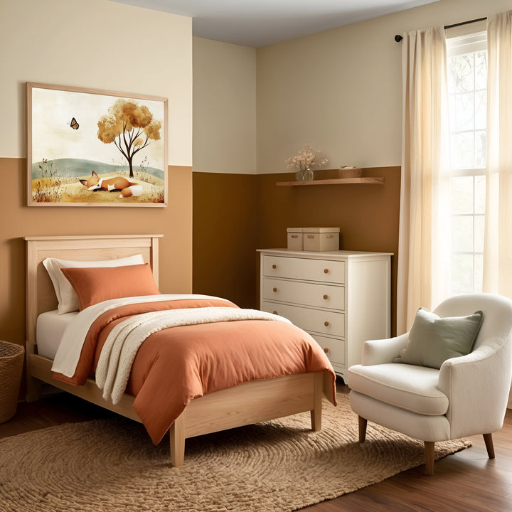 A welcoming child's bedroom featuring a wooden bed with rust-colored and cream bedding, harmonizing with warm, earthy tones throughout the room. Above the bed, an illustration of a sleeping fox beneath a tree enhances the calm and cozy atmosphere.