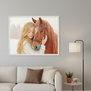 Modern living room with a beige sofa. A large framed painting of a blonde girl hugging a brown horse in a snowy landscape hangs above the sofa. A floor lamp, side table, potted plant, and mug are to the right.