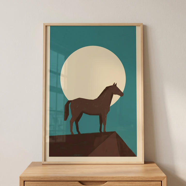 Full moon brown horse wall art in a wood frame on a cabinet shows a minimalist horse on a peak against a moon and teal sky.