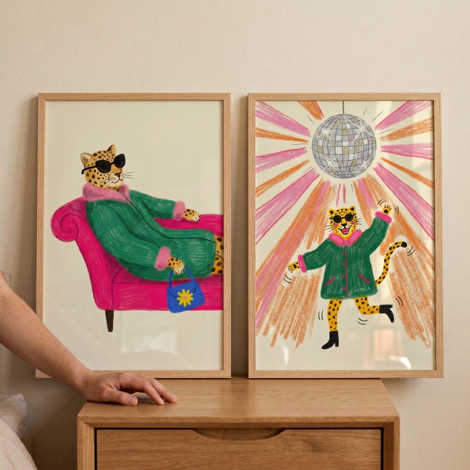 Funky green coat leopard wall art set of 2 shows a leopard on a pink sofa and another dancing under a disco ball.