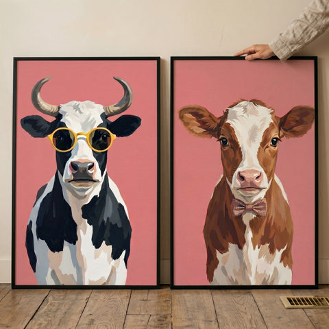 Funky pink cow wall art set of 2 features a cow in yellow sunglasses and a calf wearing a checkered bowtie.
