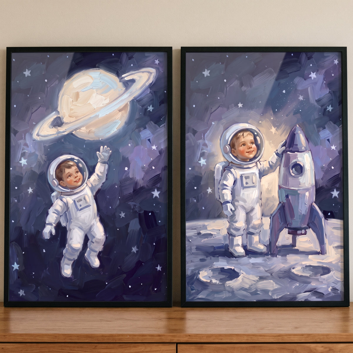 Galactic starry baby astronaut wall art set of 2 showing children in spacesuits with a ringed planet and a rocket.