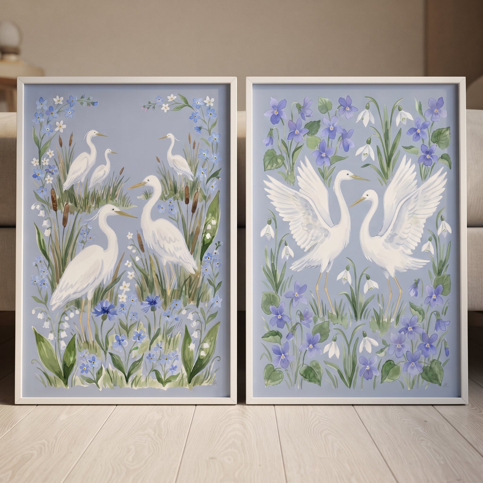 Garden wetland white heron bird wall art set of 2 featuring herons among blue flowers and green leaves.