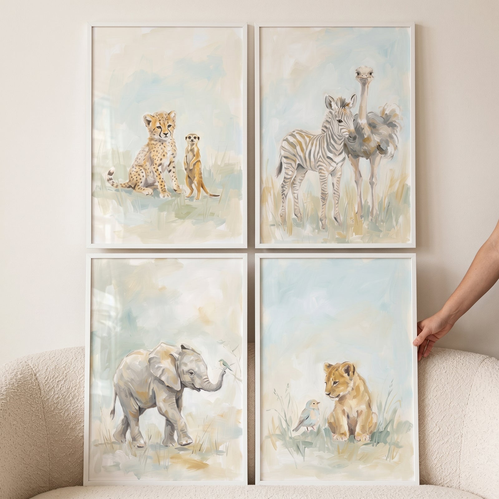 Gentle pastel safari animals wall art set of 4 featuring a cheetah, meerkat, zebra, ostrich, elephant, and lion cub.