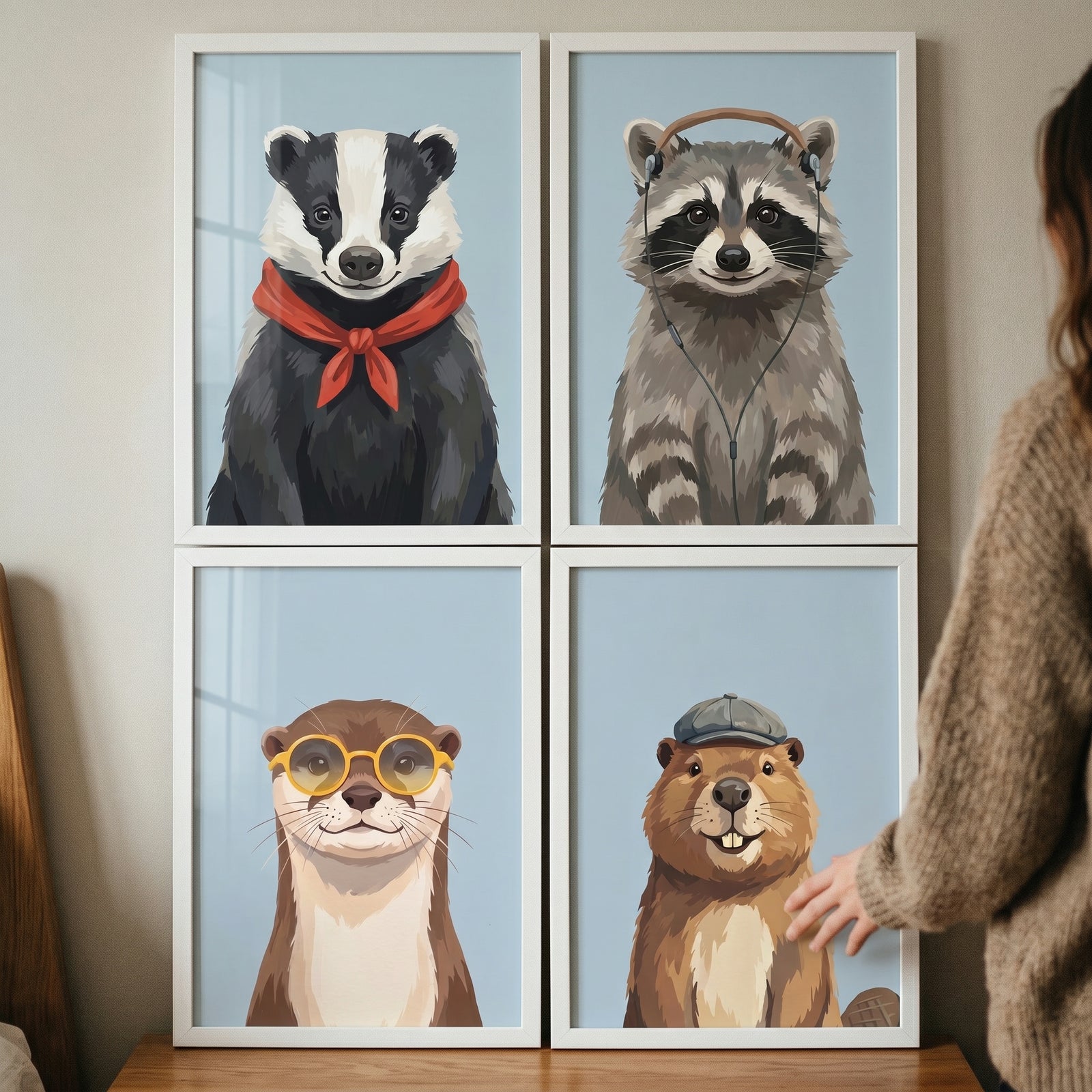 Gentle smiling forest animal wall art set of 4 features a badger, raccoon, otter, and beaver wearing cute accessories.