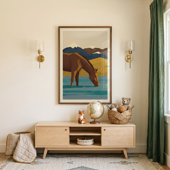 Geometric teal water horse wall art hangs above a wooden console with a globe, fox, and toy basket in a neutral room.