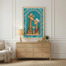 Close-up of a framed drawing of three giraffes in cowboy-themed outfits with hats and bandanas, held against a wall by a hand. The colorful illustration pops with a bright teal sky, yellow stars, and a scalloped red-and-white border, giving it a cheerful western vibe.