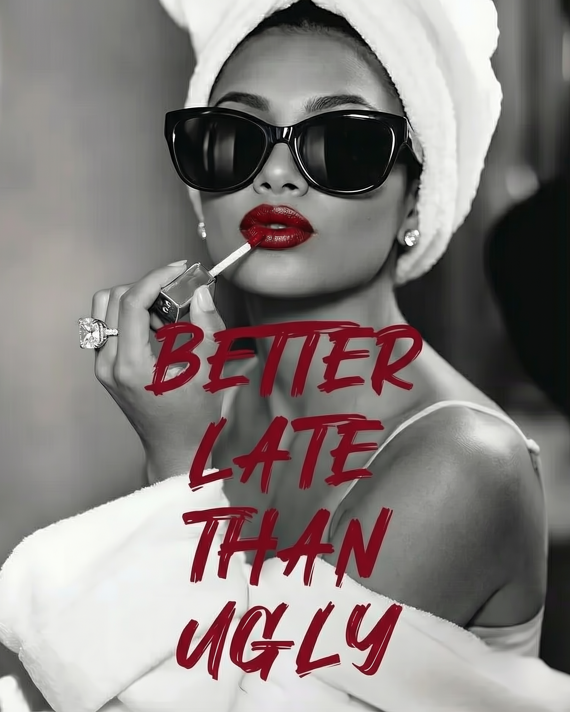 Stylish black and white image of a woman in a towel and sunglasses applying red lipstick, with the bold caption “Better late than ugly” in red text overlaying the photo.

