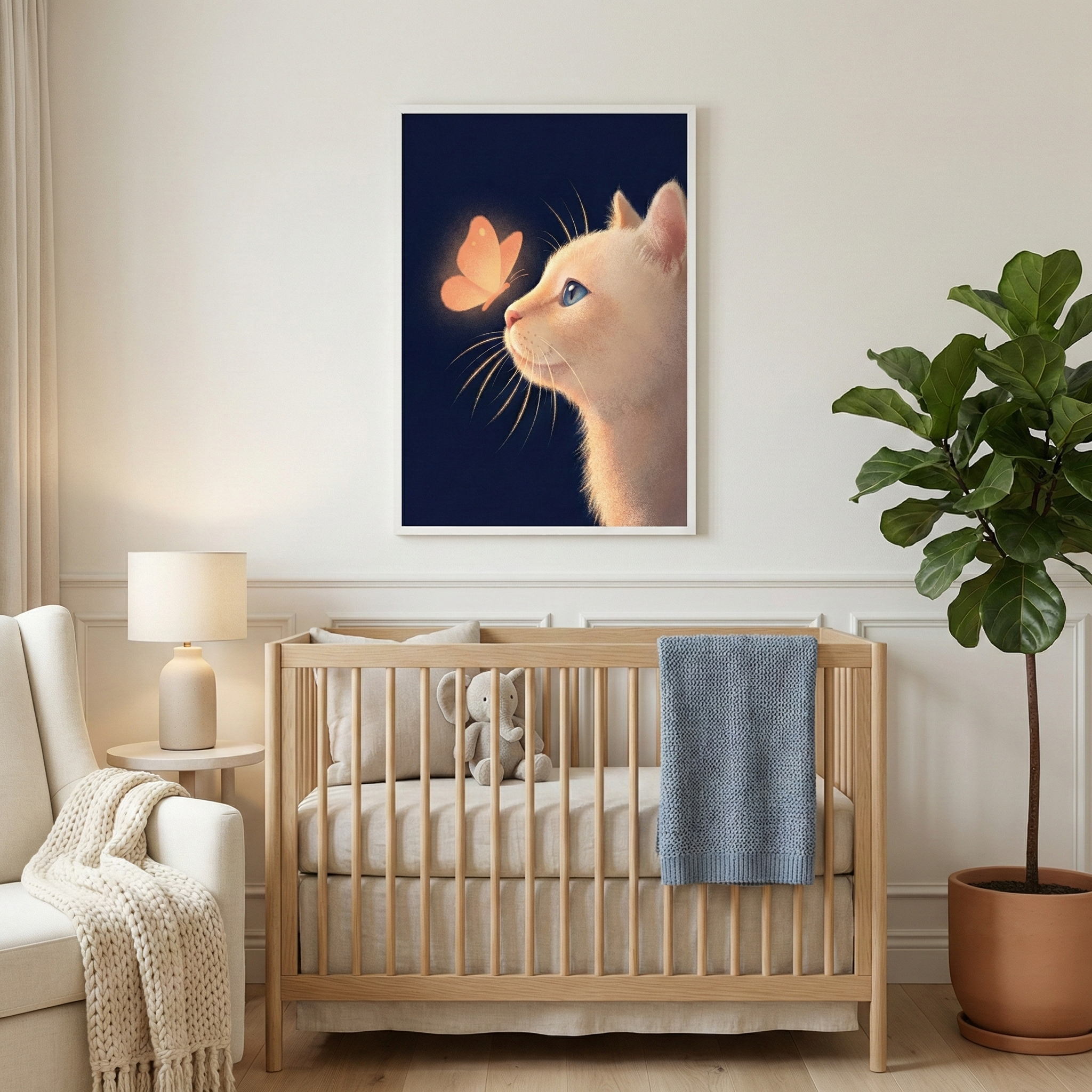A serene nursery scene features a light-toned wooden crib centered against a white paneled wall. A framed artwork above the crib displays a cream-colored cat's profile looking up at a glowing orange butterfly on a dark blue background. To the left is a white armchair with a chunky knit throw and a small side table with a lamp. To the right stands a tall, leafy green plant in a terracotta pot. The room is decorated in soft, neutral colors, creating a peaceful and warm environment.