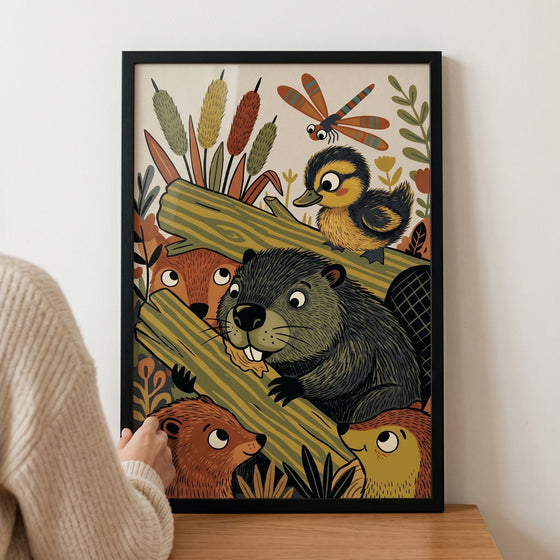 Hand holds a framed gnawing log woodland beaver animals wall art featuring forest creatures including a duckling.