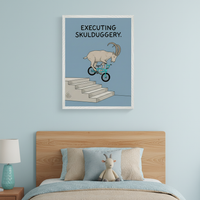 Kid's bedroom with a light wood bed and a plush goat toy. A framed print hangs centered above the bed, depicting a cartoonish goat on a blue BMX bike jumping down stairs, with the text "EXECUTING SKULDUGGERY." A lamp is on a nightstand to the left.