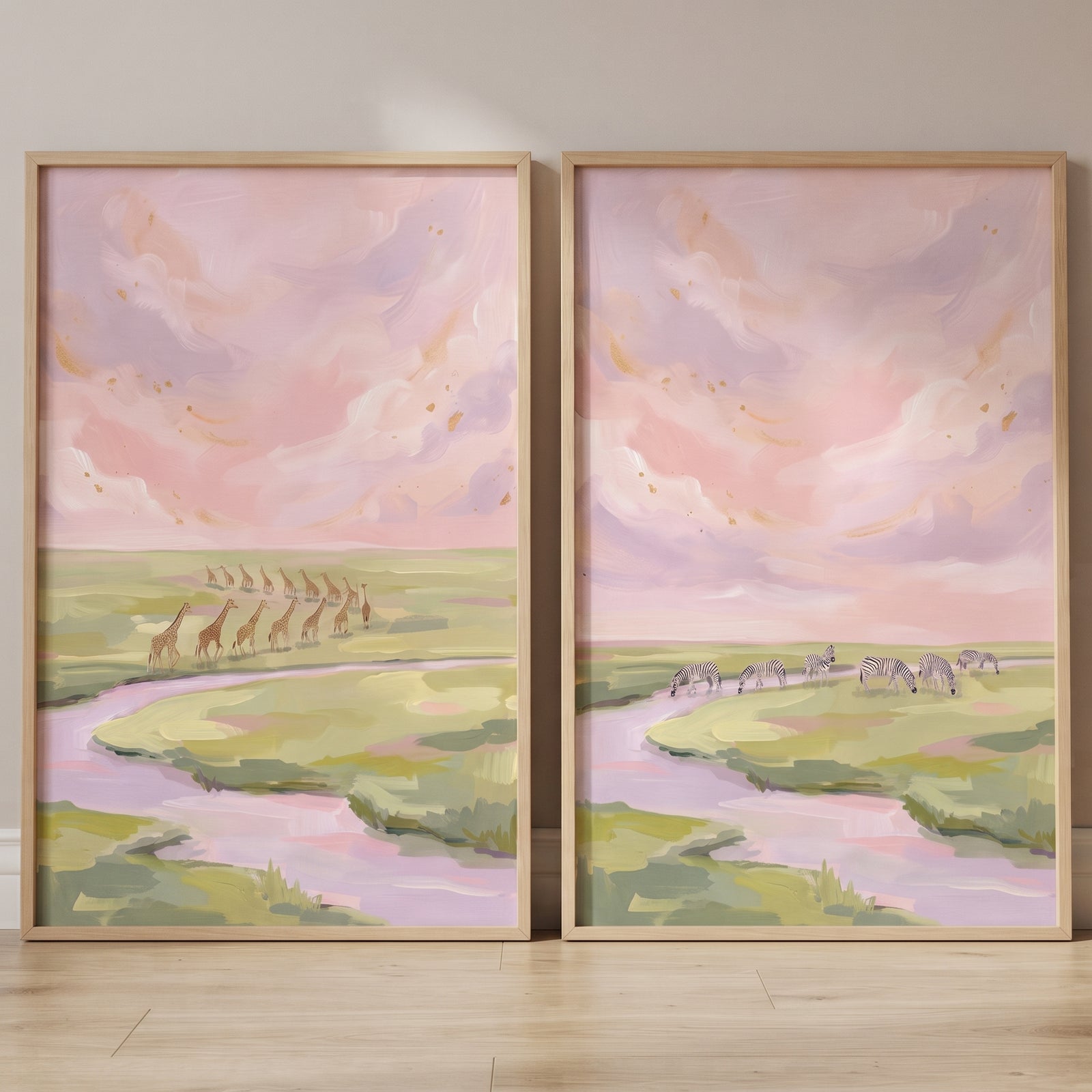 Giraffes and zebras roam a pastel savanna in this gold flecked safari animals wall art set of 2.