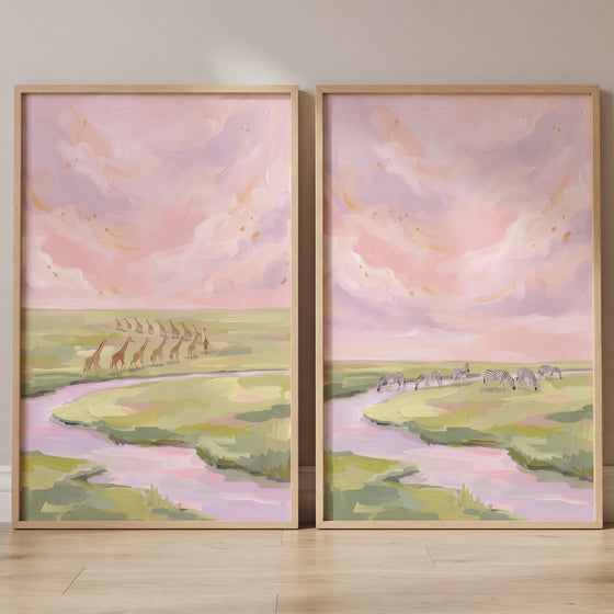 Giraffes and zebras roam a pastel savanna in this gold flecked safari animals wall art set of 2.