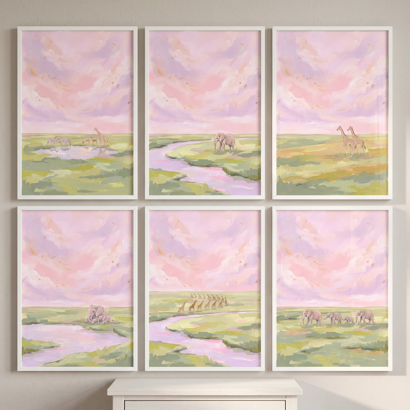 Gold leaf sky safari animals print set of 6 in white frames showing giraffes and elephants under pink watercolor clouds.