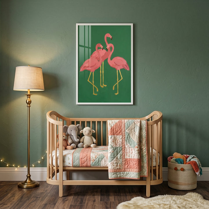 Nursery featuring gold leg pink flamingo wall art on a green wall above a wood crib with a quilted blanket.